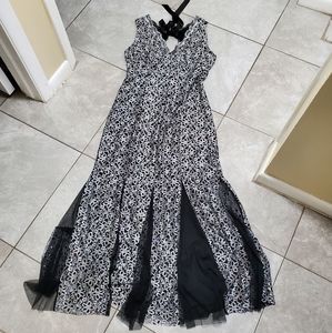 Black, shimmering silver. Sparkling dress. Floor length. Never worn. Size L